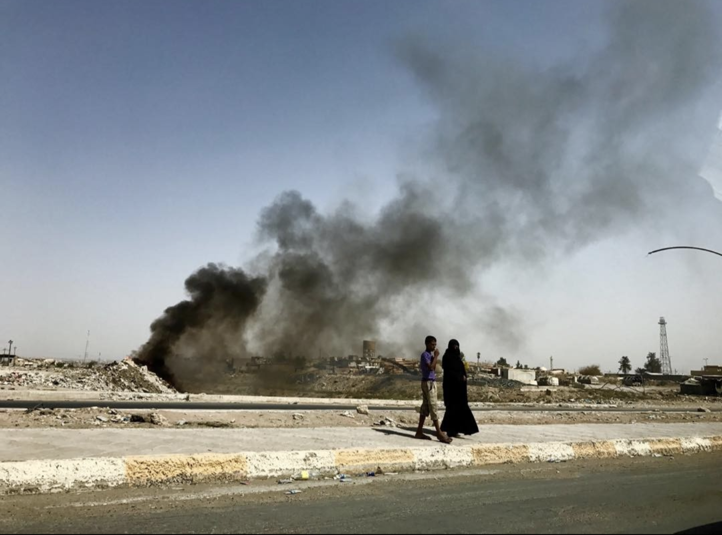 a woman walking in iraq